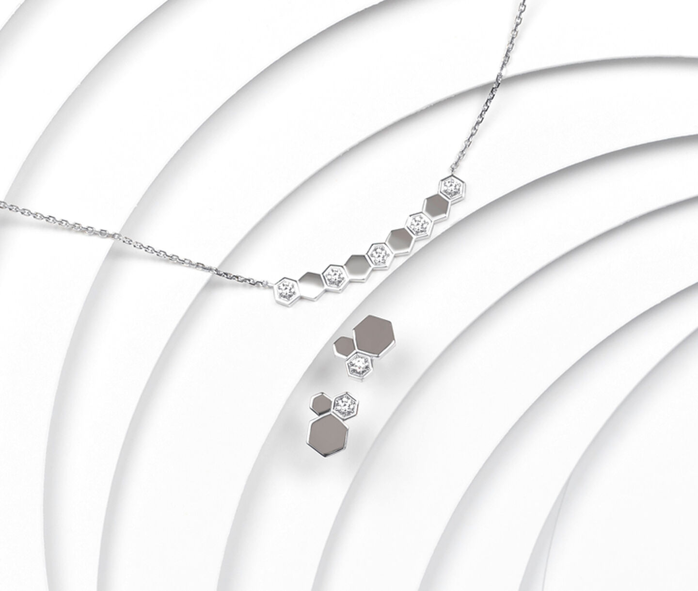 White gold and diamond hexagonal necklace with matching earrings